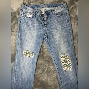 Michael Kors blue jeans with ripped design at knees